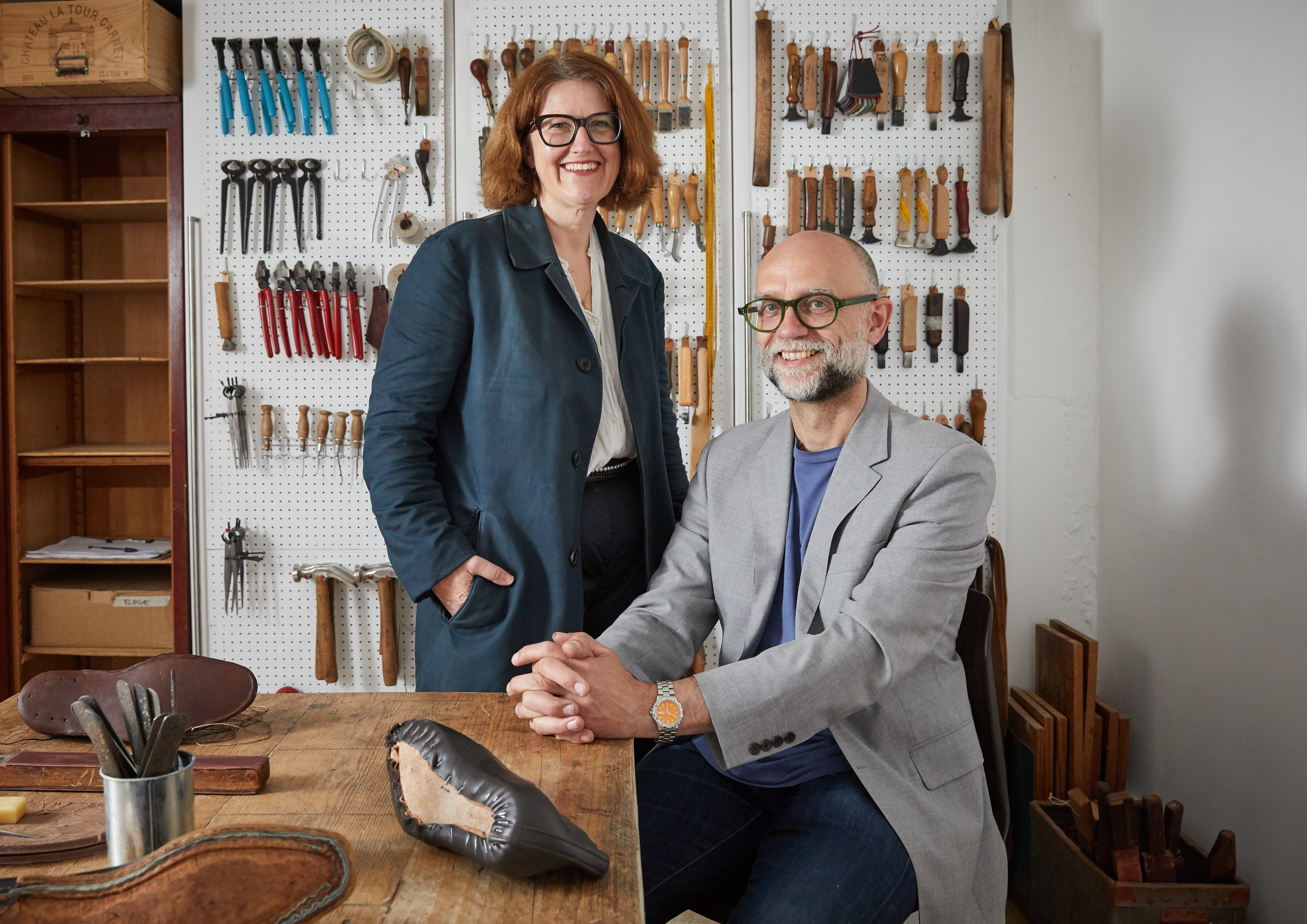 Deborah and James from Carreducker pictured in their studio at Oxo Tower Wharf surrounded by shoe making tools