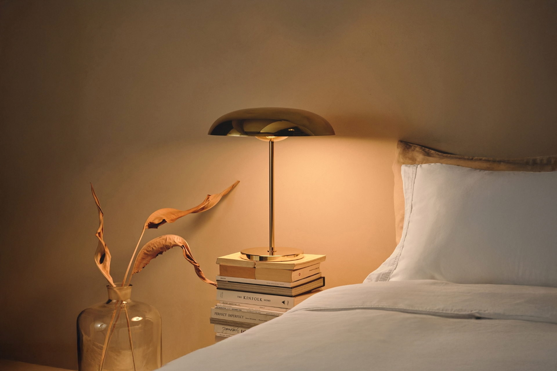 Table Light in bedroom on stack of books by bed