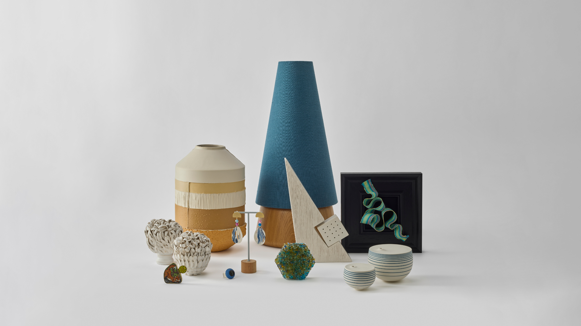 A selection of ceramics, jewellery, glass and textiles from the Crafted Futures exhibition