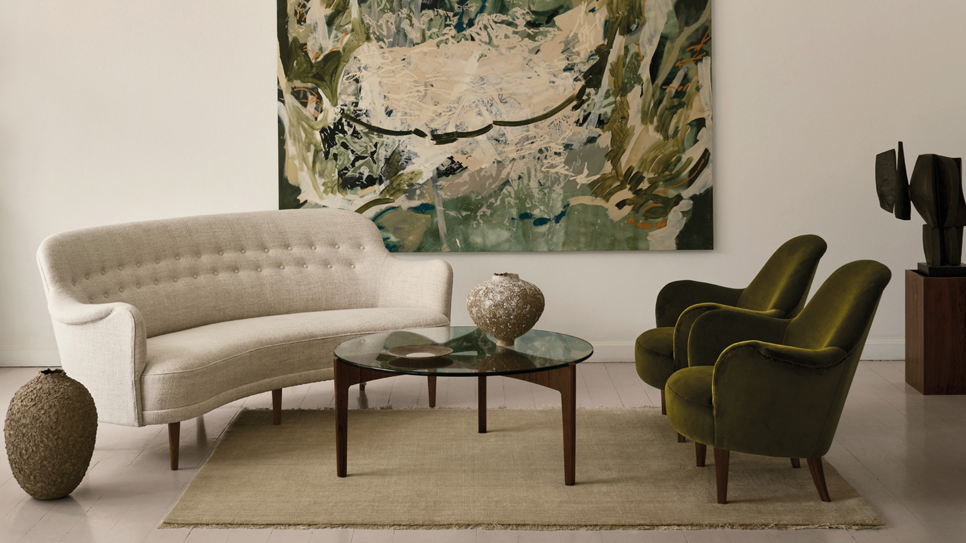 One Carl Malmsten sofa, two pairs of Carl Malmsten chairs, and an artwork by Ash Holmes