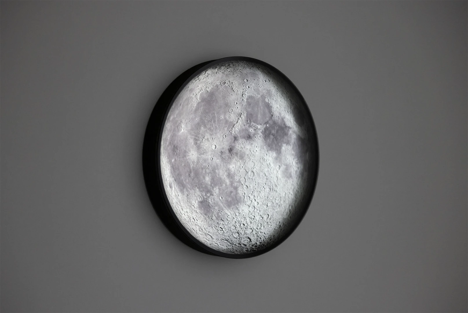 A long-form lunar timepiece, an the moon's image synchronises with the cycles of the moon in the sky, in real time 