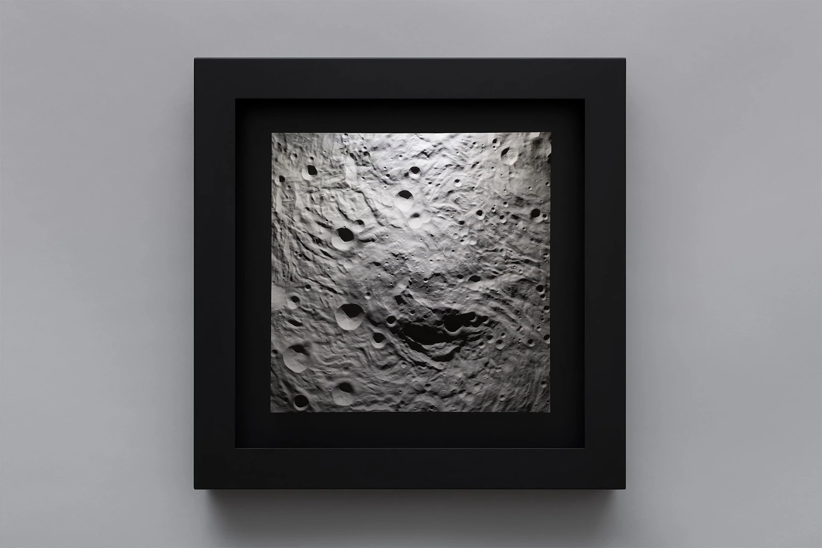 Light illumintes the detailed surface of an asteroid 