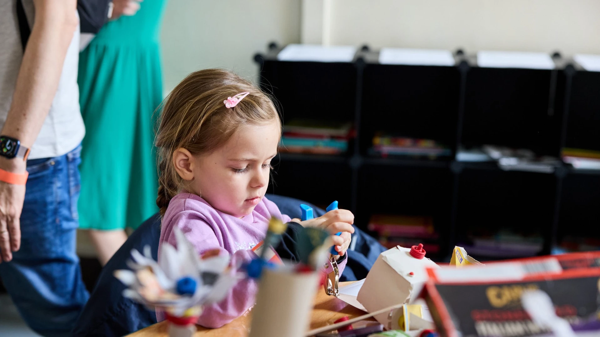 Young girl playing with SnapKit focussed on making a creation