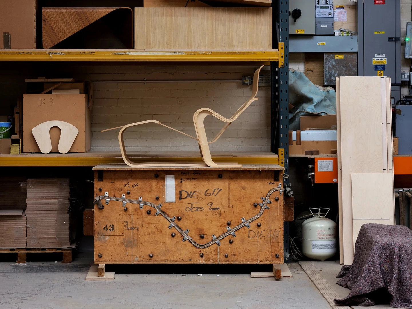 Isokon Long Chair by Marcel Breuer sat on its press in the Isokon workshop, Walthamstow, East London