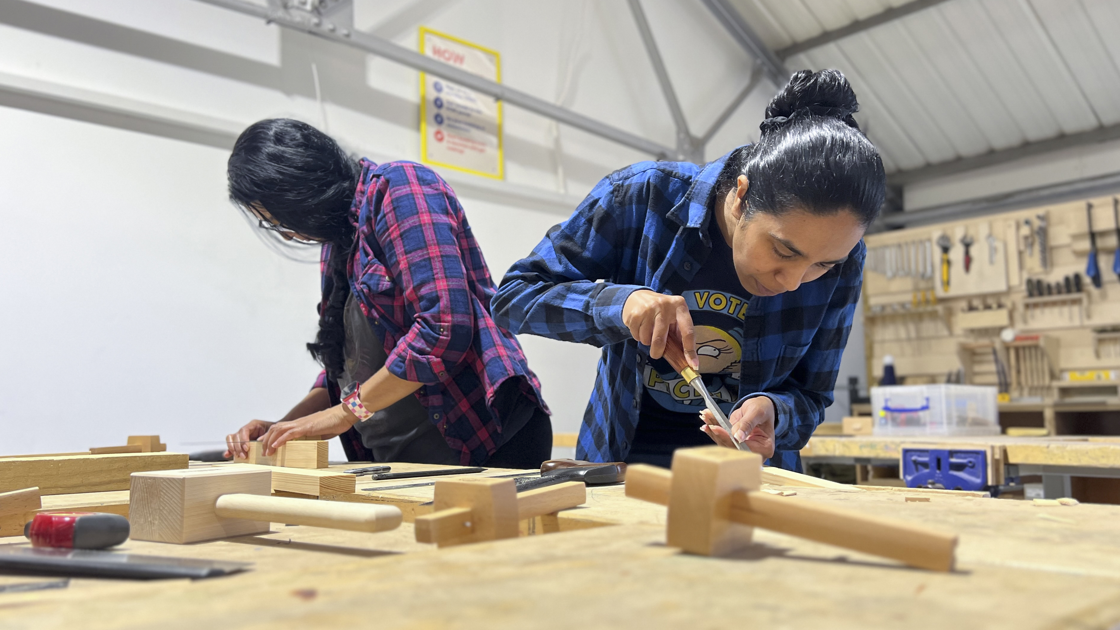 Two students at a joinery workshop.
