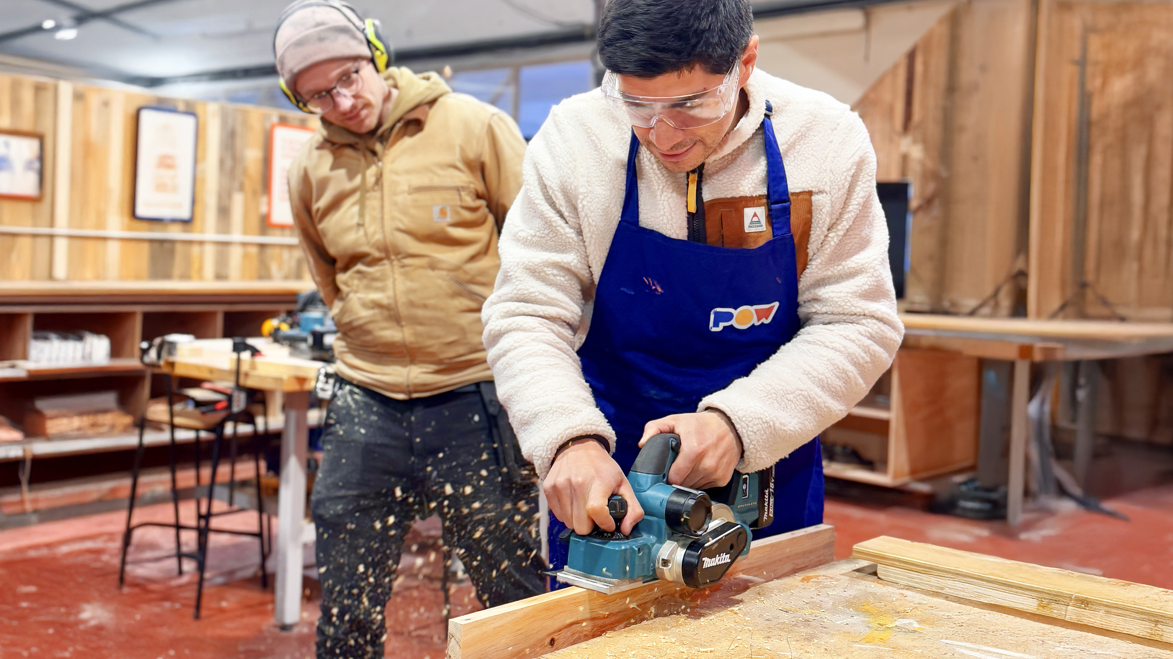 Student and teacher at a power tools workshop.