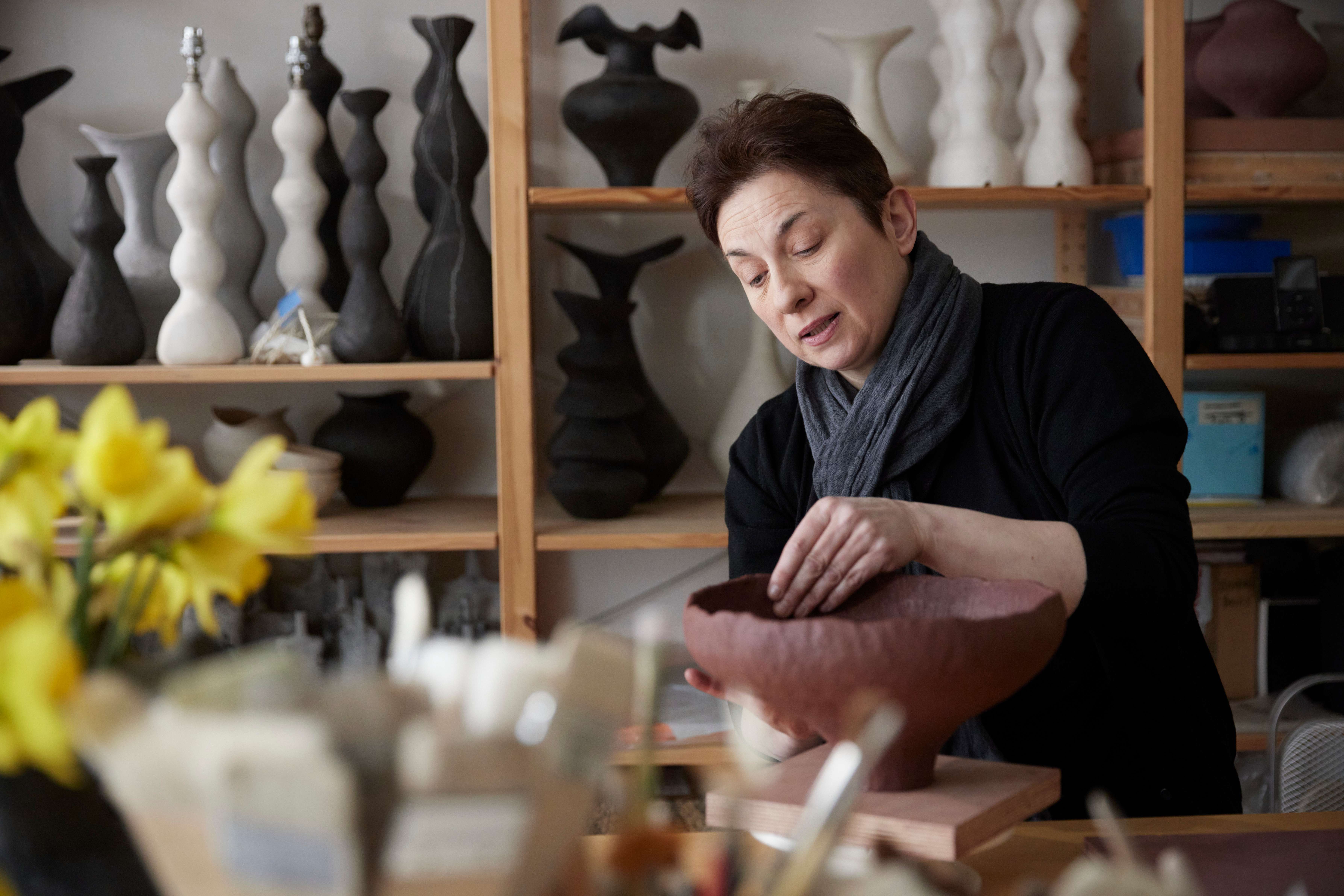 Image of a woman creating ceramics.