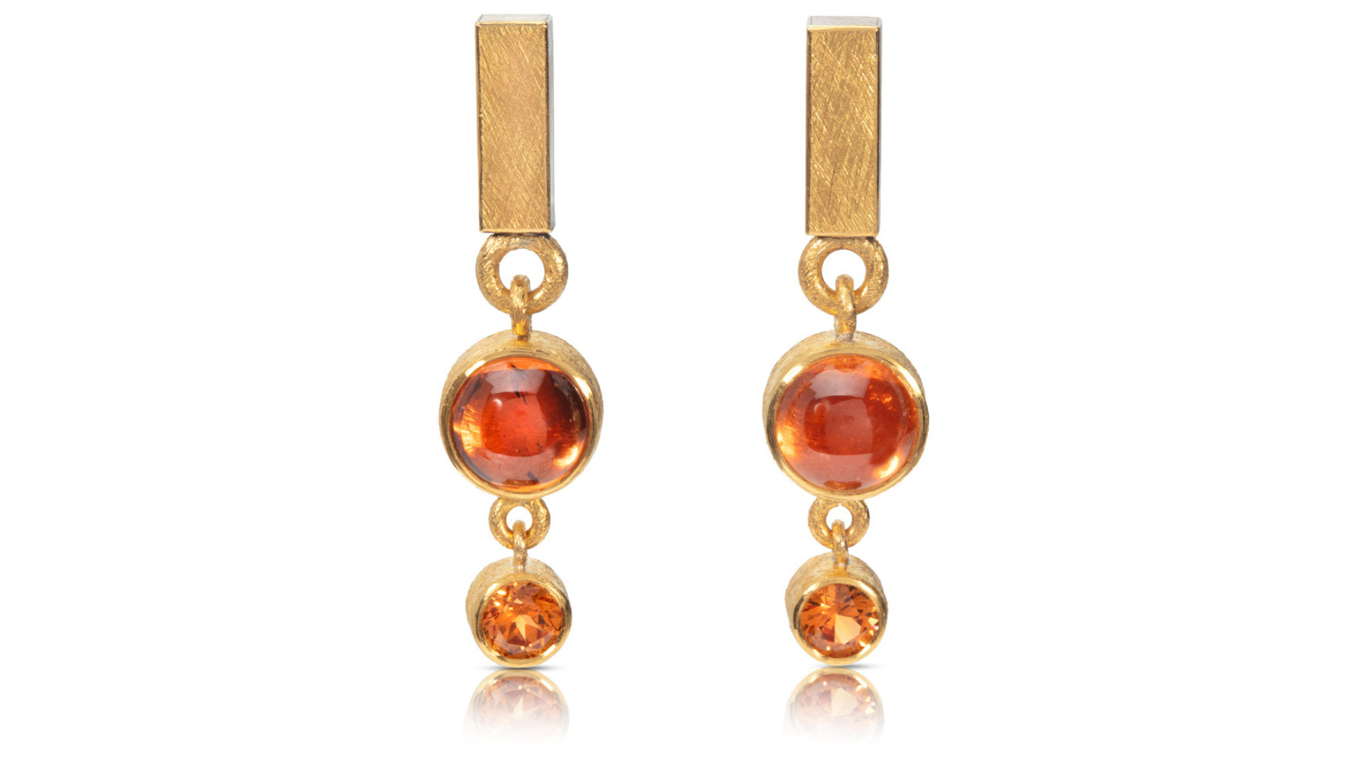 Image of a pair of ruby gold earrings.
