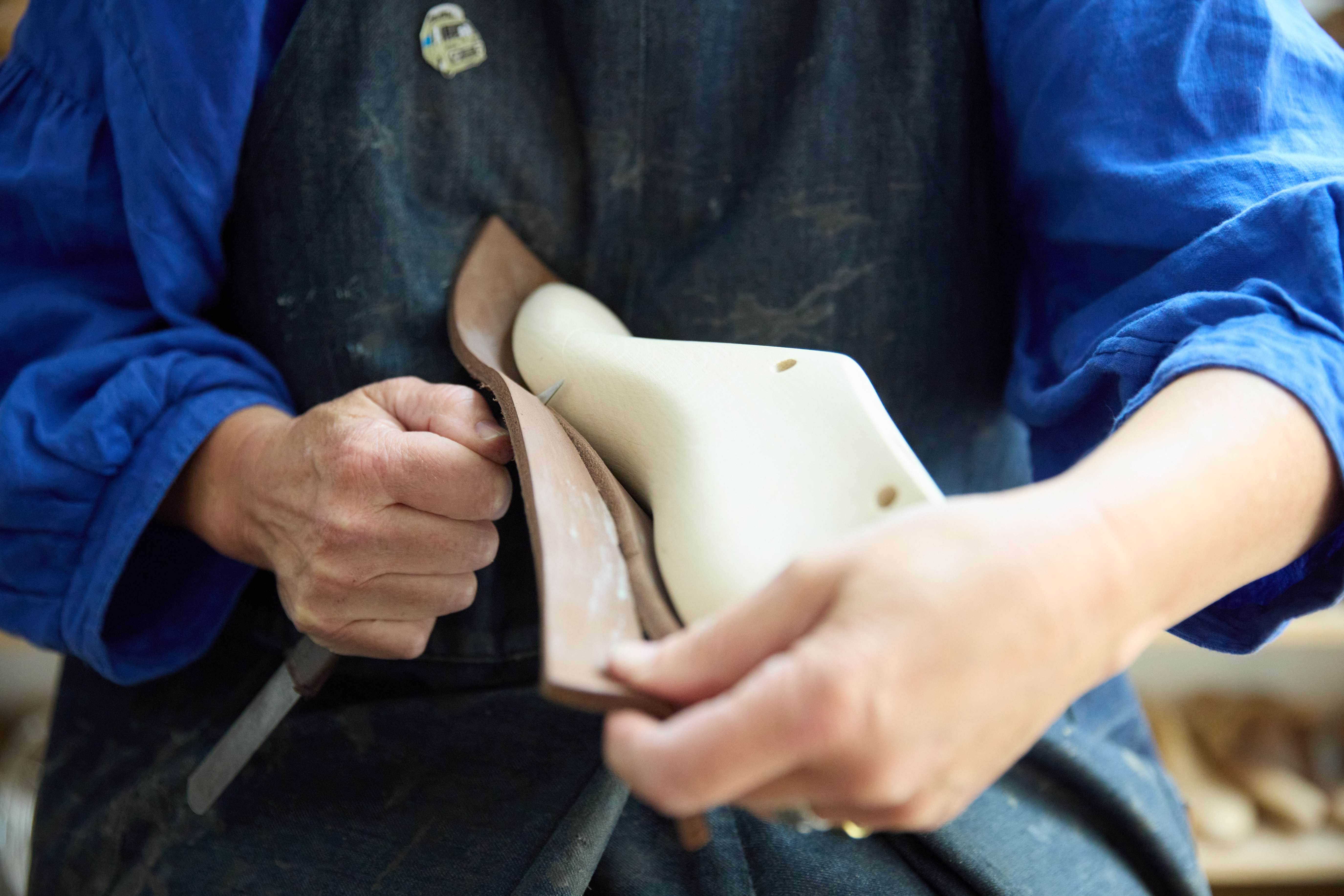 Image of someone making a shoe.