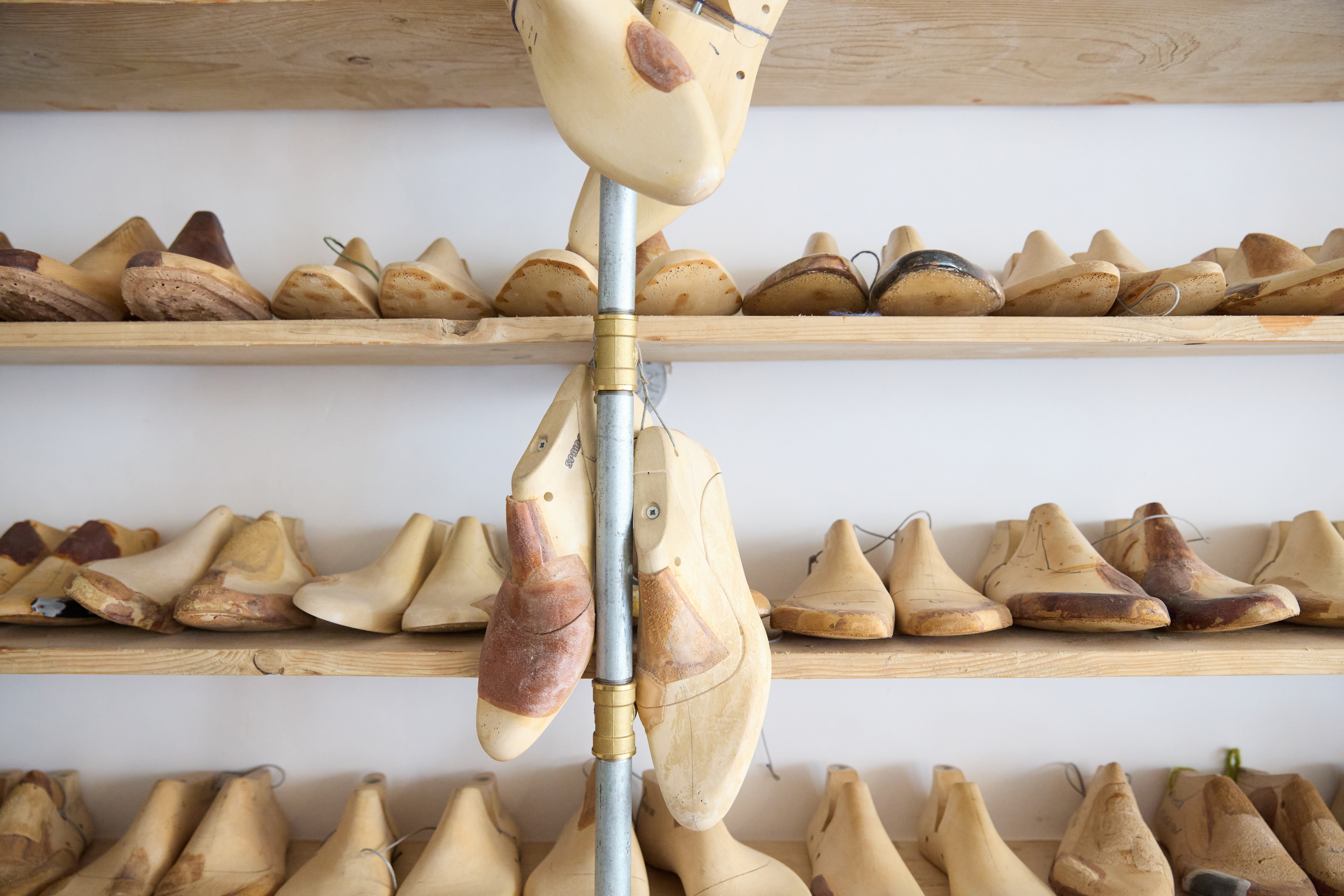Image of a row of wooden shoes.
