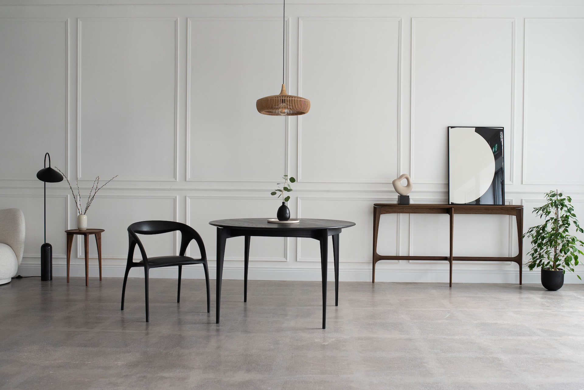 A collection of hand carved furniture pieces in a room setting