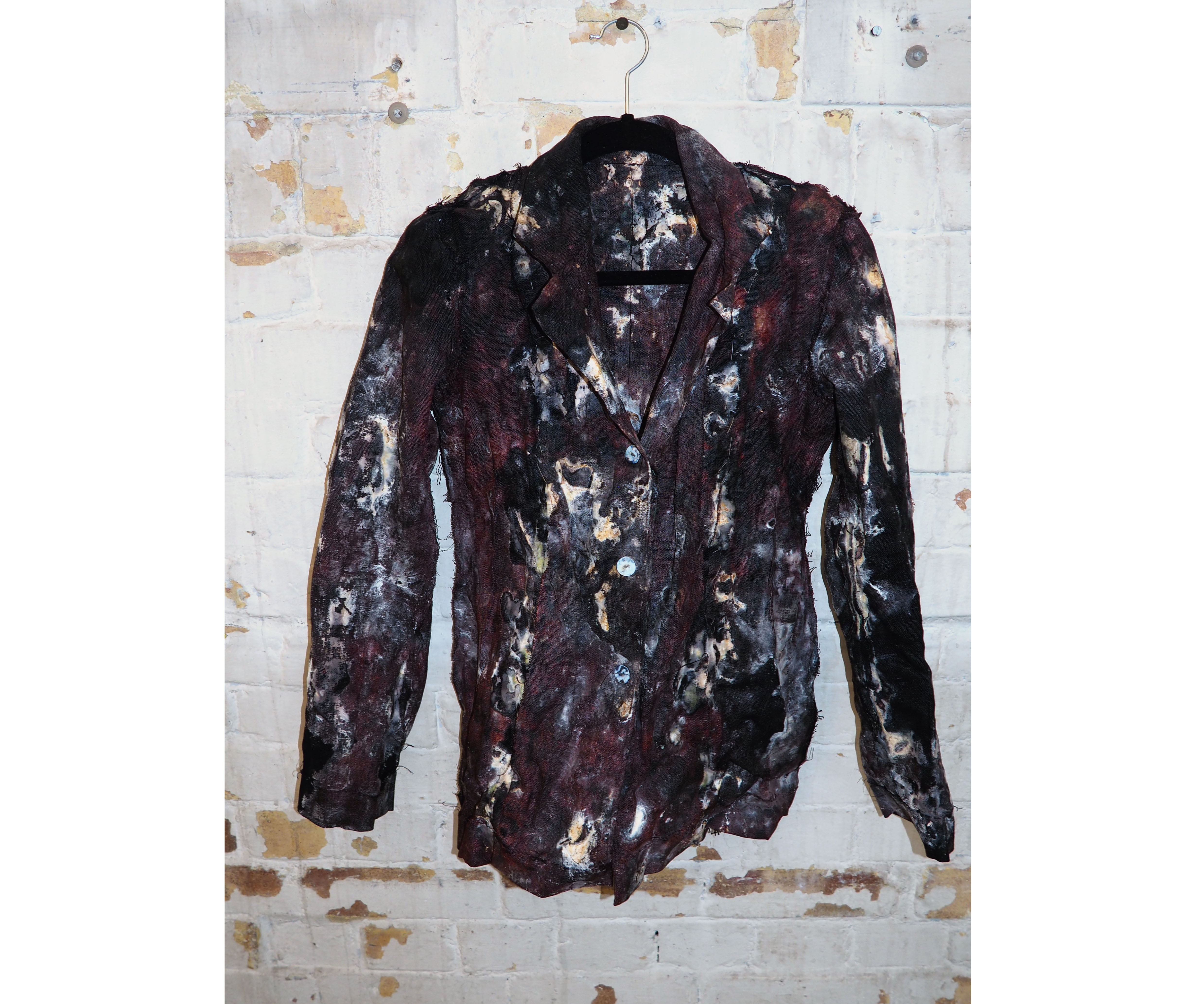 Hand sewn linen jacket inoculated with mycelium. Dried & wearable.